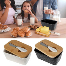 Load image into Gallery viewer, Family enjoying breakfast with porcelain butter dishes, bamboo lids, and snacks on the table.
