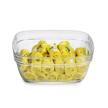 Load image into Gallery viewer, Clear glass container with yellow rolled-up items on a white background
