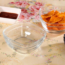 Load image into Gallery viewer, Clear glass bowls with tortilla chips and a dark sauce on a floral tablecloth.
