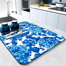 Load image into Gallery viewer, Blue floral placemat on a kitchen counter with cutlery
