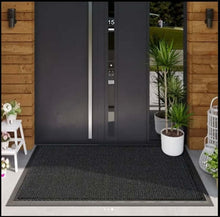 Load image into Gallery viewer, Modern black door with digital display in a well-maintained outdoor area.
