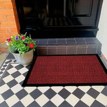 Load image into Gallery viewer, High elasticity red outdoor doormat placed at an entrance with potted flowers, designed to trap dirt and moisture.

