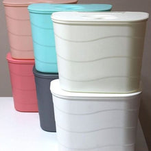 تحميل الصورة في عارض المعرض، Stack of colorful plastic storage bins on a white surface with a neutral background
