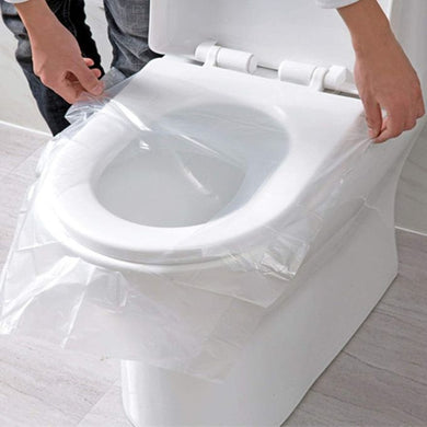Person using a clear plastic bag to cover a toilet seat.