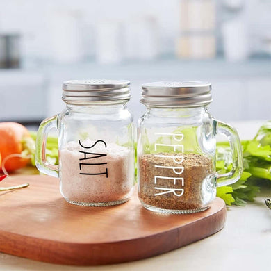 Vintage glass salt and pepper shakers set of 2 with stainless steel lids and handles, perfect for rustic or modern kitchens.