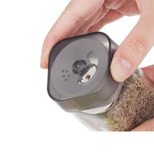 Load image into Gallery viewer, Shakers - Glass Spice seasoning jars Set of 2 with Plastic Lids &amp; Holder, showing a hand holding the shaker lid.

