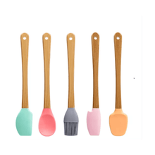 تحميل الصورة في عارض المعرض، Colorful mini silicone spatulas with wooden handles, perfect for kids and beginner cooks in baking.
