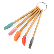 تحميل الصورة في عارض المعرض، Colorful mini silicone spatula set with wooden handles on a ring, perfect for baking and cooking with kids.
