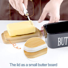 Load image into Gallery viewer, Butter dish with bamboo lid serving as a butter board, featuring a stick of butter and a cutting knife.
