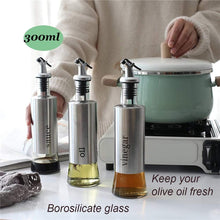 تحميل الصورة في عارض المعرض، Stainless steel oil and vinegar dispenser set, 300ml capacity, borosilicate glass, perfect for keeping oils fresh.
