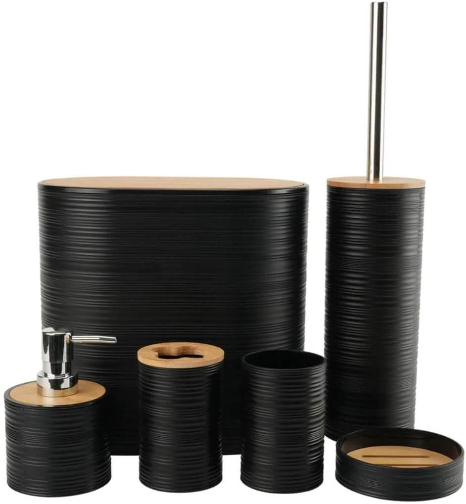 A set of black bathroom accessories with bamboo accents, including a waste bin, toilet brush, liquid soap dispenser, toothbrush holder, dry soap dispenser, and a mug.