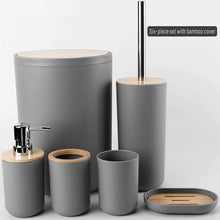 تحميل الصورة في عارض المعرض، Gray bathroom accessory set with wooden accents on a light gray background

