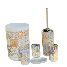 Load image into Gallery viewer, Patterned bathroom accessories including a toilet brush holder, cups, and a container on a table with a blurred greenery background.
