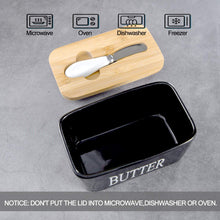 Load image into Gallery viewer, Porcelain butter dish with bamboo lid and spreader, microwave, oven, and dishwasher safe, featuring a warning label.
