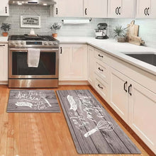 Load image into Gallery viewer, Grey wood-print runner and mat with a whisk design in a kitchen with a steel cooker
