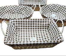 Load image into Gallery viewer, Set of checkered baskets on a wooden table with a laptop and other items in the background.
