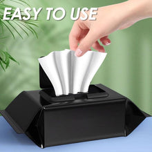 Load image into Gallery viewer, Hand pulling out a wipe from a black container, showcasing easy-to-use shoe cleaning wipes.
