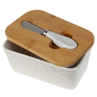 Porcelain butter dish with bamboo lid and spreader, perfect for storing butter up to 250g.