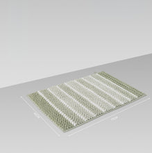 تحميل الصورة في عارض المعرض، Green and white striped bath mat on a gray surface with measurements indicated.
