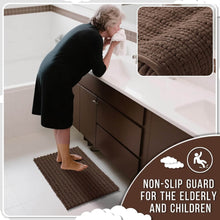 تحميل الصورة في عارض المعرض، Woman using a brown bath mat in a bathroom with an inset showing the texture of the mat.
