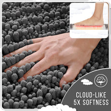 تحميل الصورة في عارض المعرض، Gray textured rug with a hand touching it, showing its softness, with a inset of feet wearing socks on a white background.
