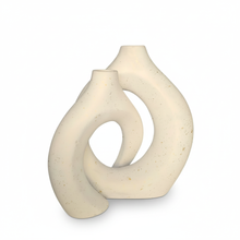 تحميل الصورة في عارض المعرض، White ceramic vase with a modern, abstract design on a white background
