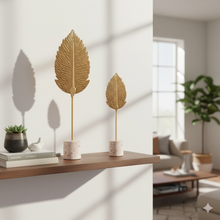 تحميل الصورة في عارض المعرض، Decorative leaf sculptures on a shelf with a living room background
