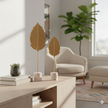 تحميل الصورة في عارض المعرض، Decorative leaf sculptures on a table in a living room setting

