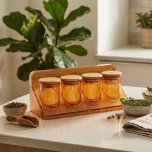 تحميل الصورة في عارض المعرض، Four glass jars with wooden lids on a metal tray.
