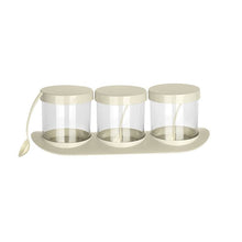 تحميل الصورة في عارض المعرض، Three clear glass spice jars with cream-colored lids and a matching cream-colored base tray, shown on a plain white background.
