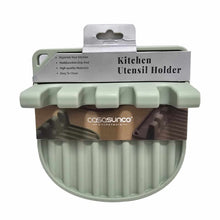 تحميل الصورة في عارض المعرض، A silicone utensil rest in gray color with raised edges and slots for holding utensils, packaged for retail sale.
