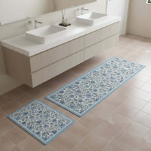 تحميل الصورة في عارض المعرض، Bathroom with two floral-patterned rugs on the floor
