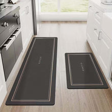 تحميل الصورة في عارض المعرض، Two black kitchen mats on a wooden floor in a modern kitchen.
