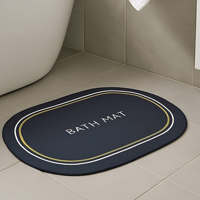 Anti-slip oval bath mat in navy blue with gold trim, ideal for bathroom safety and style.