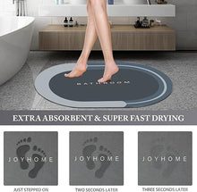 Load image into Gallery viewer, Foot on extra absorbent bathroom mat showing quick drying feature with footprint marks, demonstrating effectiveness and modern design.
