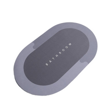 Load image into Gallery viewer, A gray, round anti-slip rubber bathroom mat with the word &#39;BATHROOM&#39; printed on the surface.
