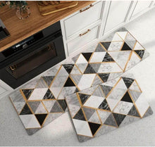 Load image into Gallery viewer, Geometric patterned rug on a kitchen floor with wooden counters and white cabinets.
