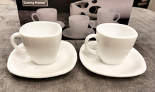 Load image into Gallery viewer, Two white ceramic espresso cups with saucers on a gray surface, with &#39;Danny Home&#39; packaging in the background.
