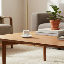 Load image into Gallery viewer, White ceramic cup and saucer on a gray background
