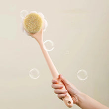 Load image into Gallery viewer, Hand holding a brush with a green bristle head against a beige background
