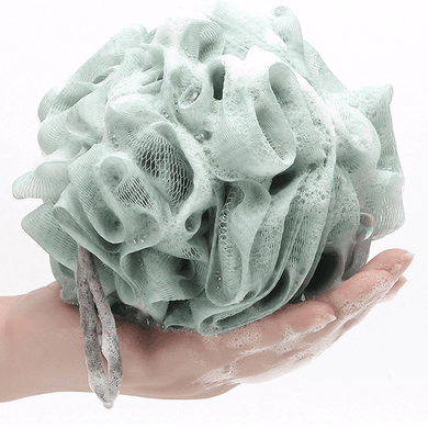 Exfoliating loofah bath sponge being held, covered in soap bubbles, showcasing high-quality mesh and long handle string.