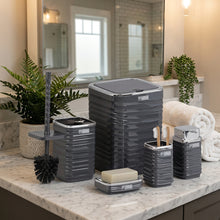 تحميل الصورة في عارض المعرض، Set of black bathroom storage containers with a soap dish and brush holder on a reflective surface.
