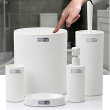 تحميل الصورة في عارض المعرض، White bathroom accessories set on a white surface with a blurred background

