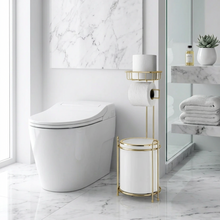 Load image into Gallery viewer, A gold framed bathroom accessory set consisting of a waste bin and a toilet tissue holder, with a white roll of tissue placed on the holder.

