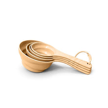 تحميل الصورة في عارض المعرض، A set of five nested measuring cups with long handles and carrying loops, shown in a light natural wood finish on a white background.
