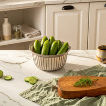 Load image into Gallery viewer, Bowls - Multi Purpose Linea Round Mixing Bowl - ( 2000 ml ) with cucumbers on a marble countertop.

