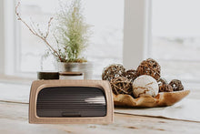 Load image into Gallery viewer, Vintage-style radio on a wooden surface with decorative elements
