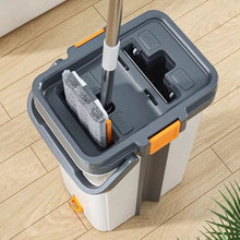 Load image into Gallery viewer, Bucket and mop cleaning set with flat mop and rectangular head resting in a cleaning bucket.
