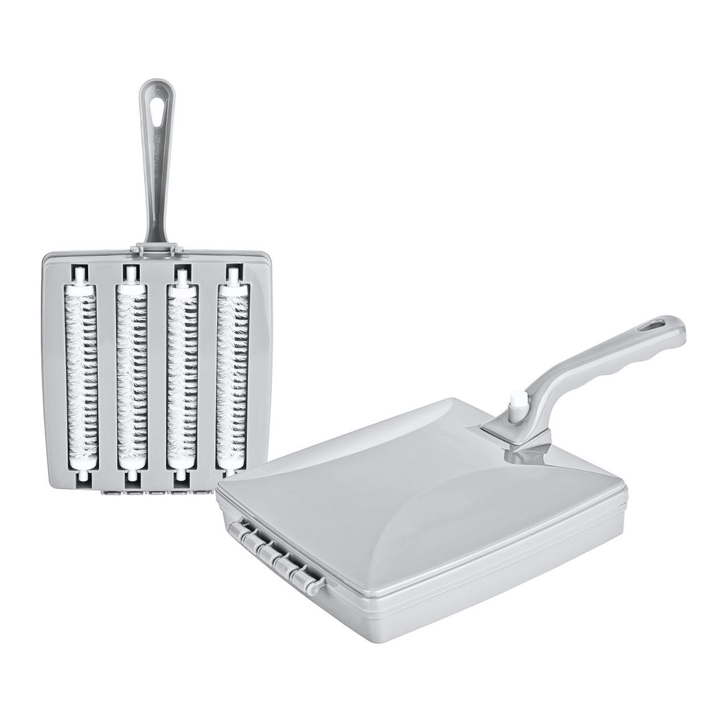 Metallic kitchen brush and scrubber on a white background