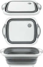 Load image into Gallery viewer, A collapsible 3-in-1 bowl that can be used as a chopping board, shown in gray and white colors, folded out and empty.
